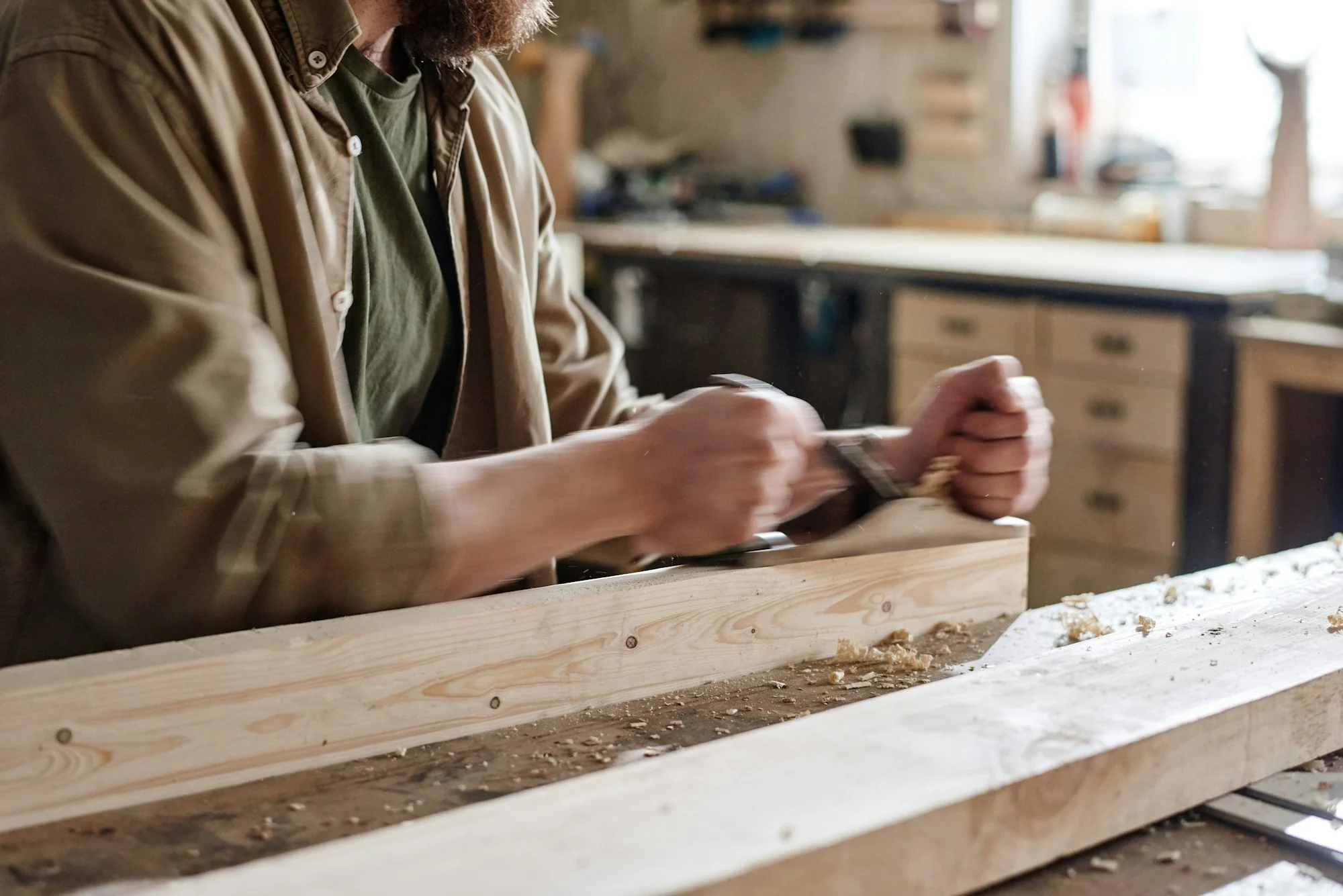 Man Using Hand Plane Man Using Hand Plane