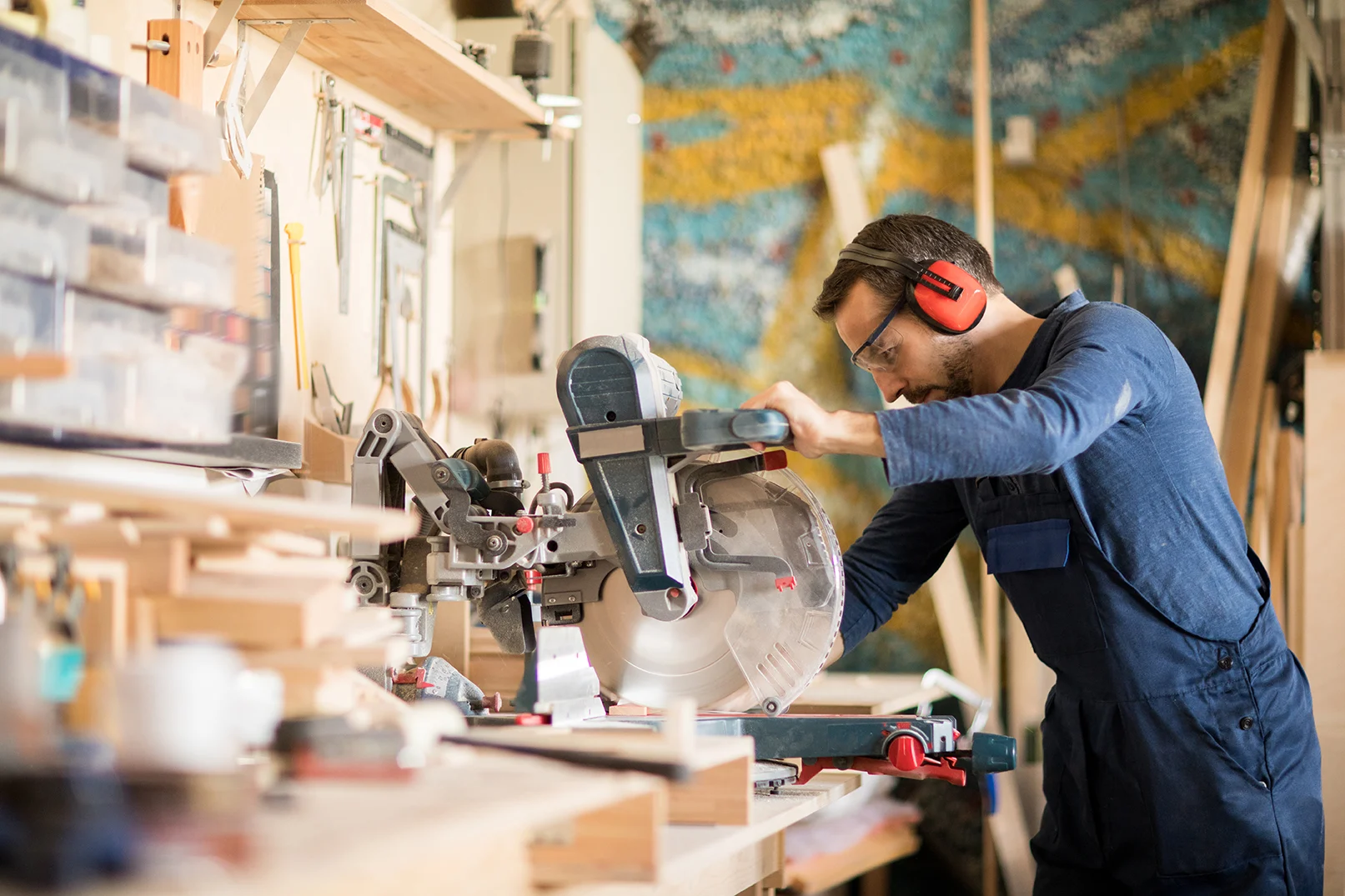 3mature-worker-cutting-wood-2023-11-27-05-13-38-utc copy Safety first, geared up, & start work.